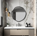 Miroir circulaire asymétrique design moderne pour intérieur contemporain