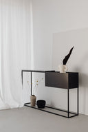 Noctis black marble console table with matte black base