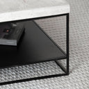 Table basse design en métal noir et travertin – Collection Noctara