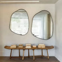 Mirror framed with a satin black metal circle