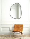 Mirror framed with a satin black metal circle